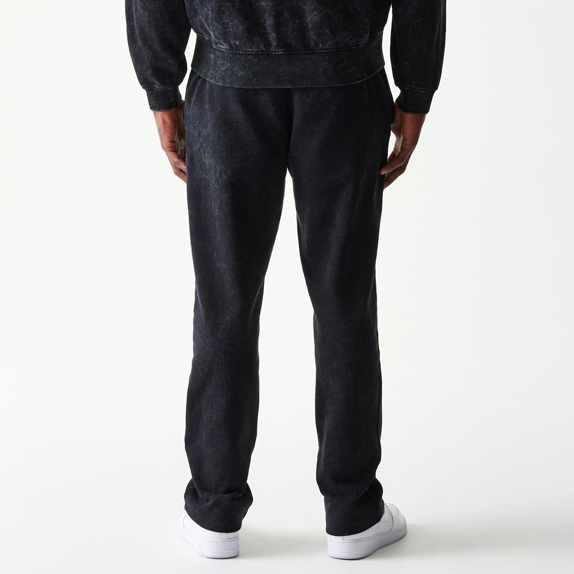 The model is wearing this Red Bull Racing Straight Leg Joggers in black. 2