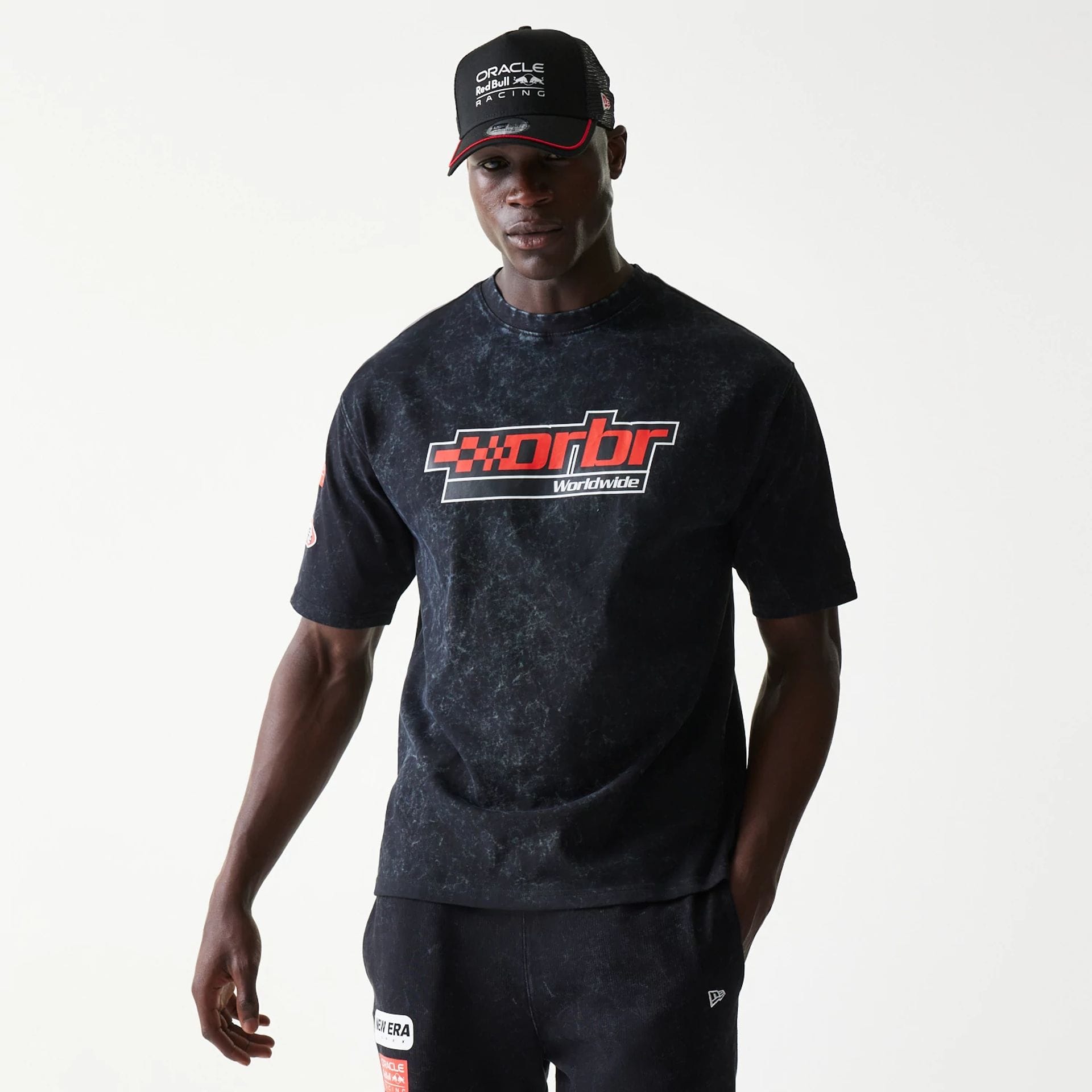 The model is wearing this Red Bull Racing Graphic Oversized T-Shirt in black. 1