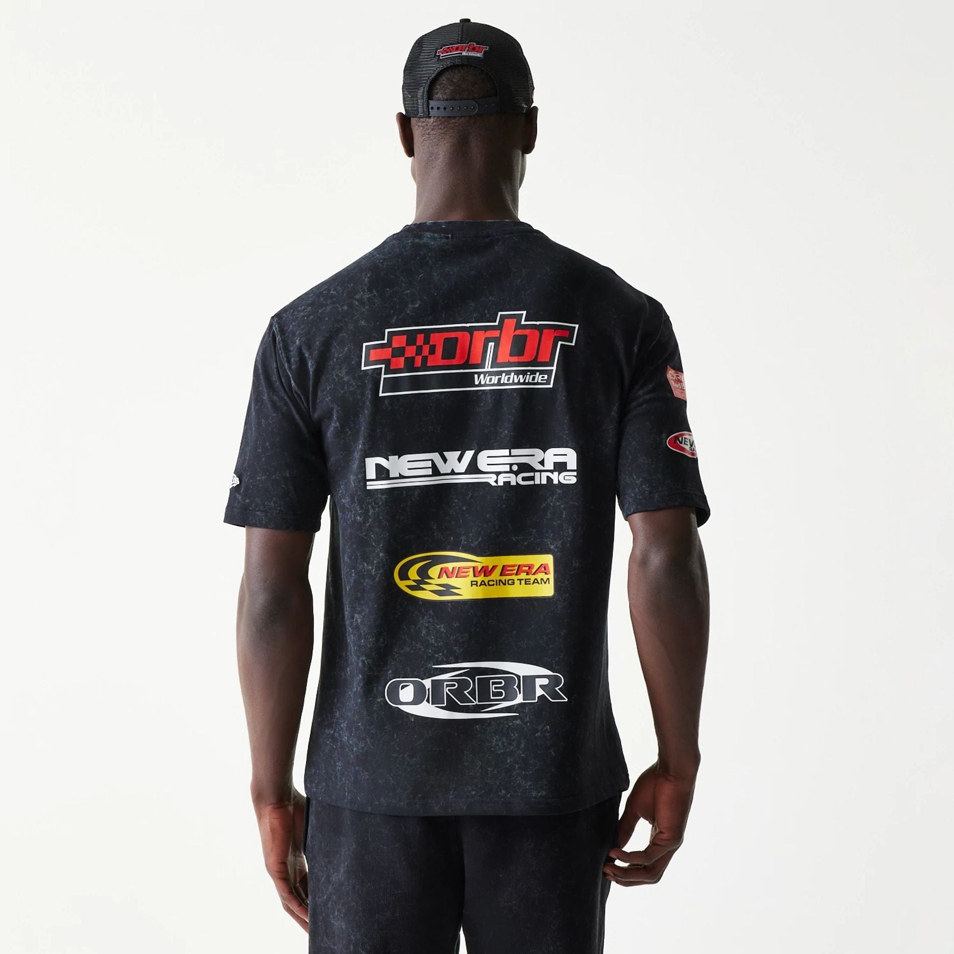 The model is wearing this Red Bull Racing Graphic Oversized T-Shirt in black. 2