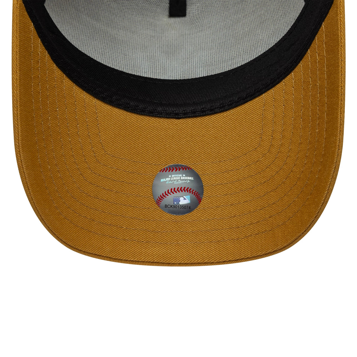 New York Yankees MLB League Essential Beige New Era 9FORTY E-Frame Cap, inside view showing the black sweatband, grey taping and a holographic sticker on the underside of the curved beige visor.