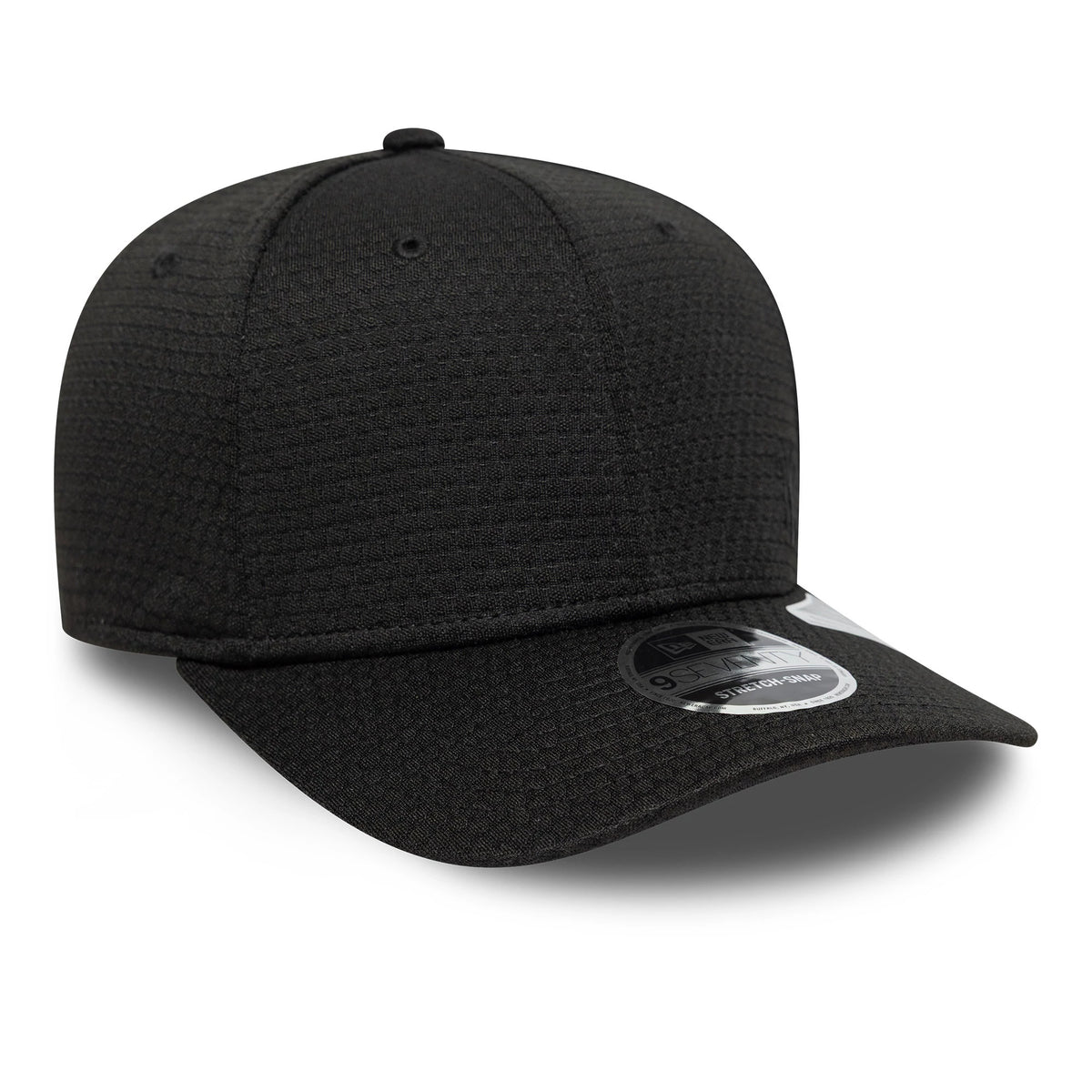 New York Yankees MLB Flawless Mesh Black New Era 9SEVENTY Stretch Snap Cap, three-quarter view showing the black embroidered Yankees logo on the front panel, curved visor and black 9SEVENTY size sticker on a structured mesh crown.