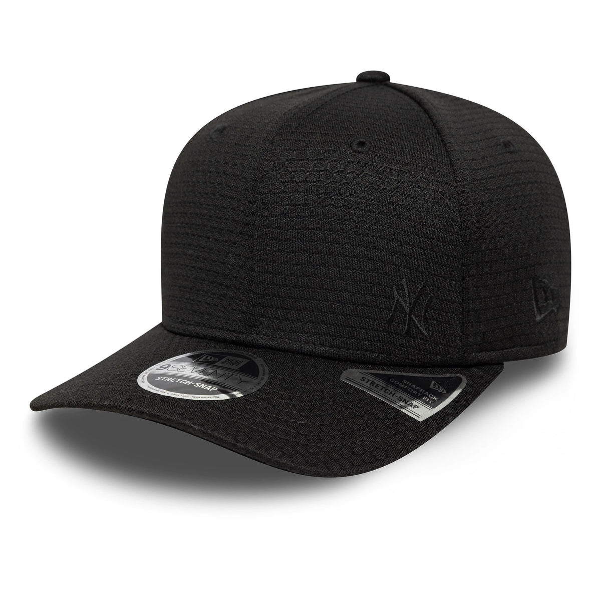New York Yankees MLB Flawless Mesh Black New Era 9SEVENTY Stretch Snap Cap, three-quarter view showing the black raised embroidered NY logo on the front panel, black mesh fabric, curved black visor, and a 9SEVENTY size sticker on the visor.
