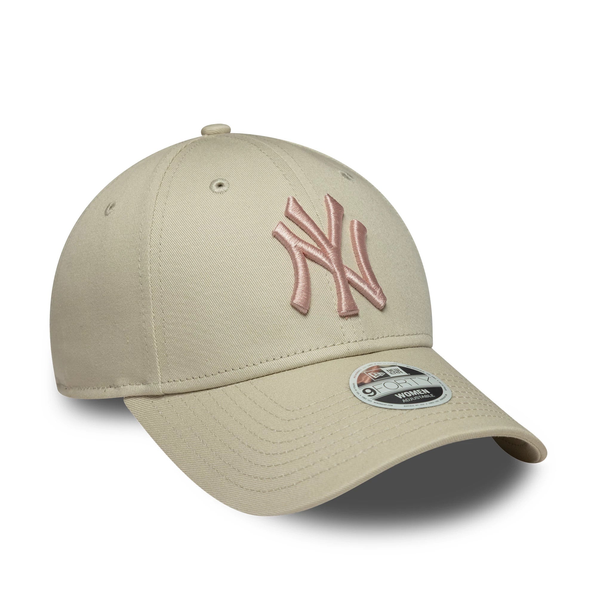 New York Yankees Womens MLB Light Beige New Era 9FORTY Cap, three-quarter view showing a pink raised embroidered NY logo on the front panel, complemented by eyelets and a matching top button, with a 9FORTY size sticker on the curved visor.