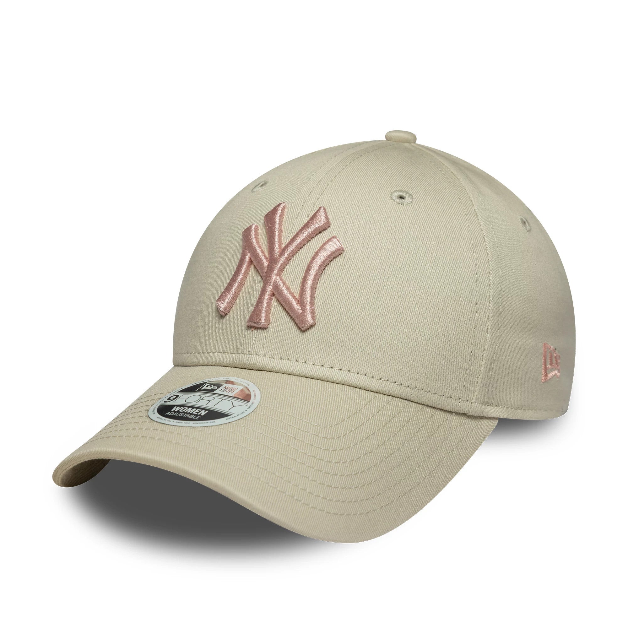 New York Yankees Womens MLB Light Beige New Era 9FORTY Cap, three-quarter view showing the pink raised embroidered NY logo on the front panel, curved visor with a 9FORTY size sticker, and New Era flag logo in pink on the left side.