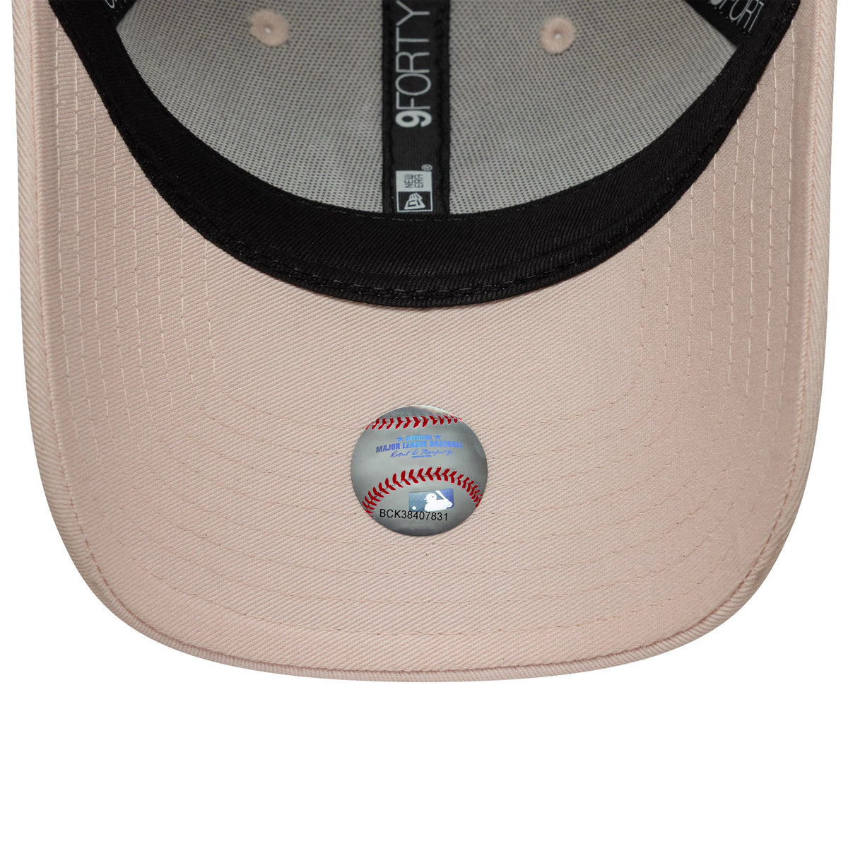 New York Yankees Womens MLB Metallic Logo Pastel Pink New Era 9FORTY Cap, inside view showing the grey undervisor with a baseball graphic, black sweatband, and taping with the 9FORTY logo.