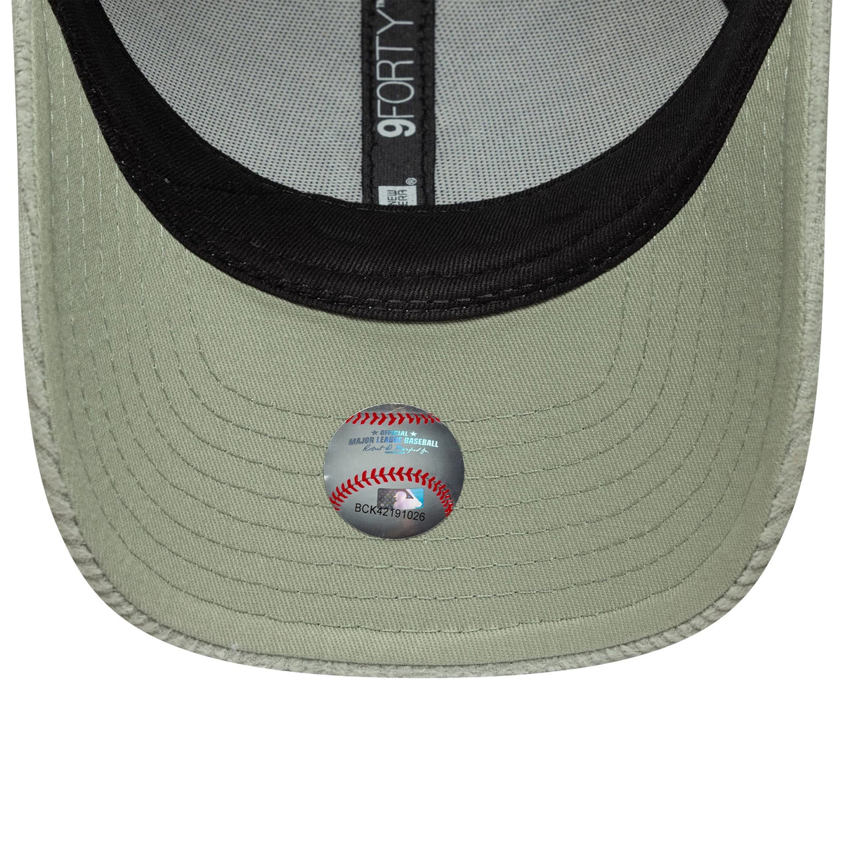 New York Yankees Womens MLB Pastel Cord Green New Era 9FORTY M-Crown Cap, inside view showing black sweatband, grey taping with 9FORTY branding, and a baseball-themed sticker on the green undervisor.