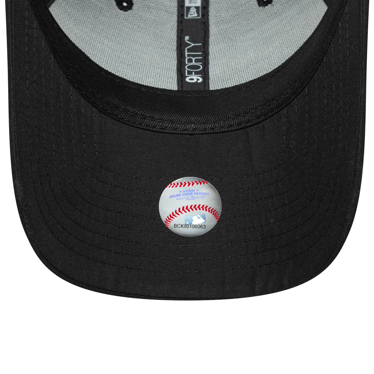 New York Yankees Womens MLB Flawless Black New Era 9FORTY Cap, inside view showing the grey sweatband, branded interior taping with the 9FORTY label, and a detailed baseball sticker on the black undervisor.