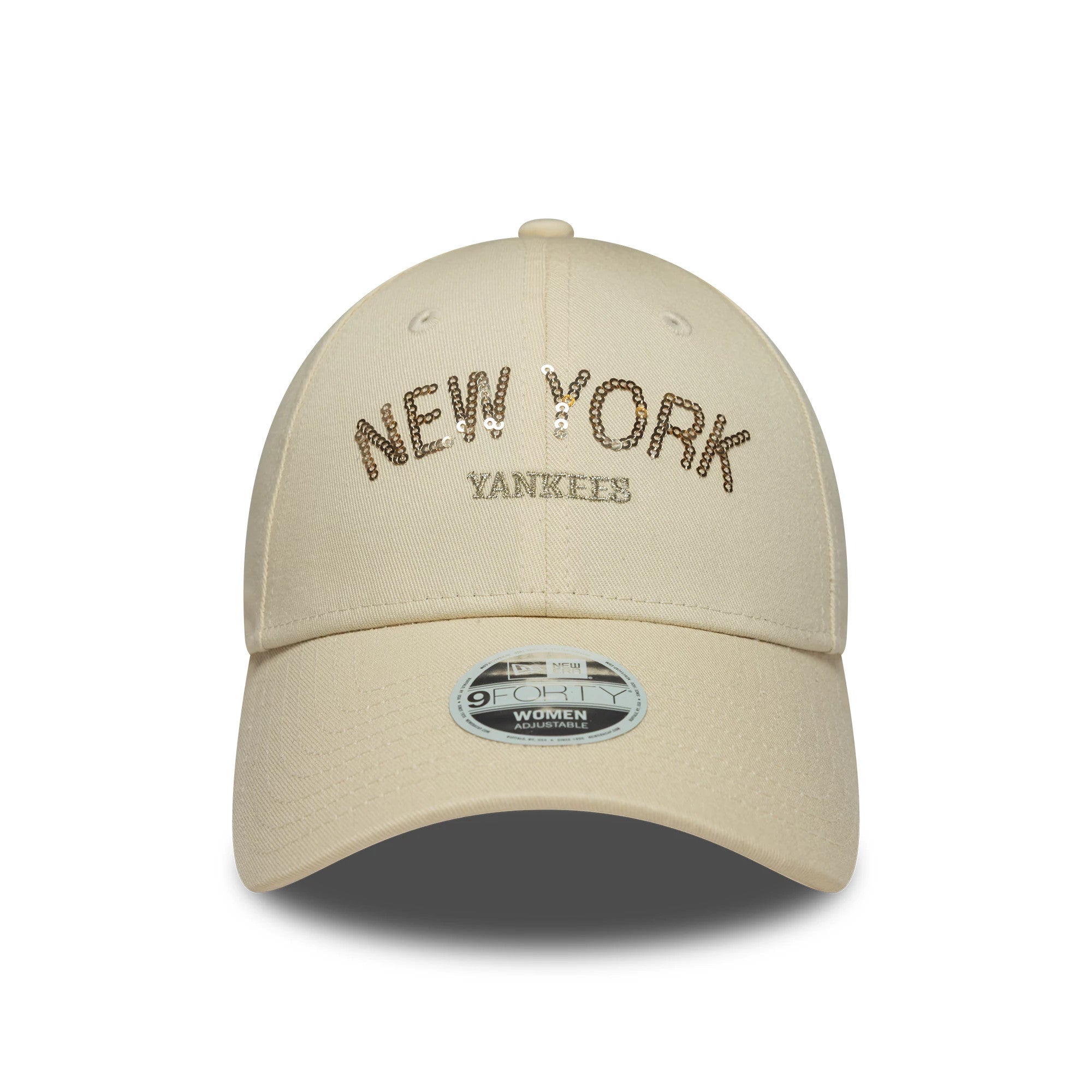 New York Yankees Womens MLB Sequin Wordmark Light Beige New Era 9FORTY Cap, front view showing the sparkling gold sequin New York text and flat white Yankees embroidery, with a light beige curved visor and 9FORTY size sticker.