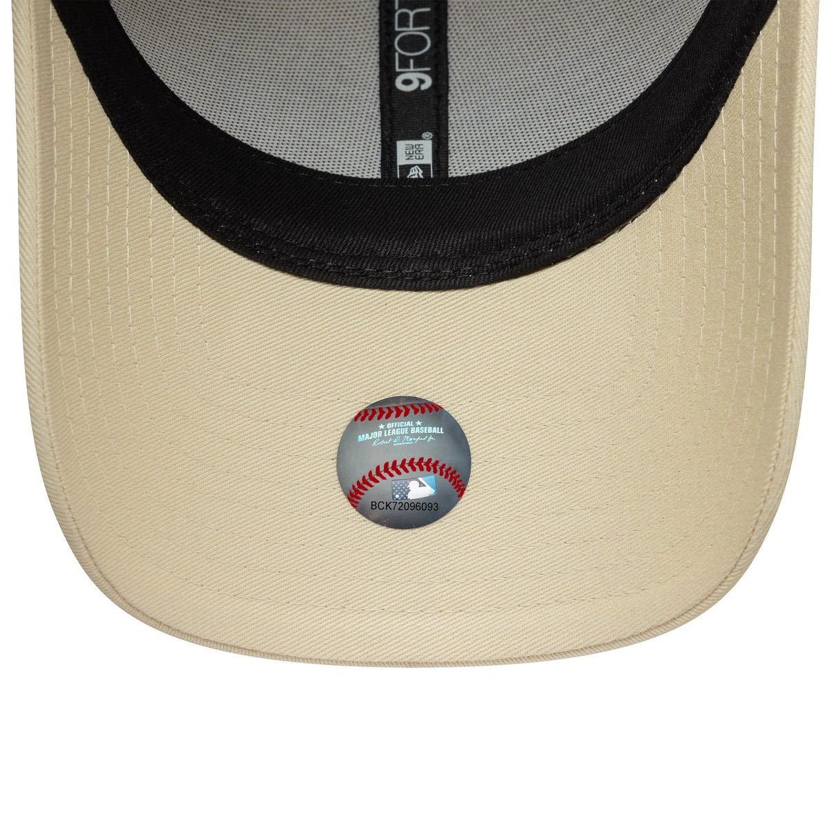New York Yankees Womens MLB Sequin Wordmark Light Beige New Era 9FORTY Cap, inside view showing black taping with logo details, a black sweatband, and a circular MLB holographic sticker on the light beige undervisor.