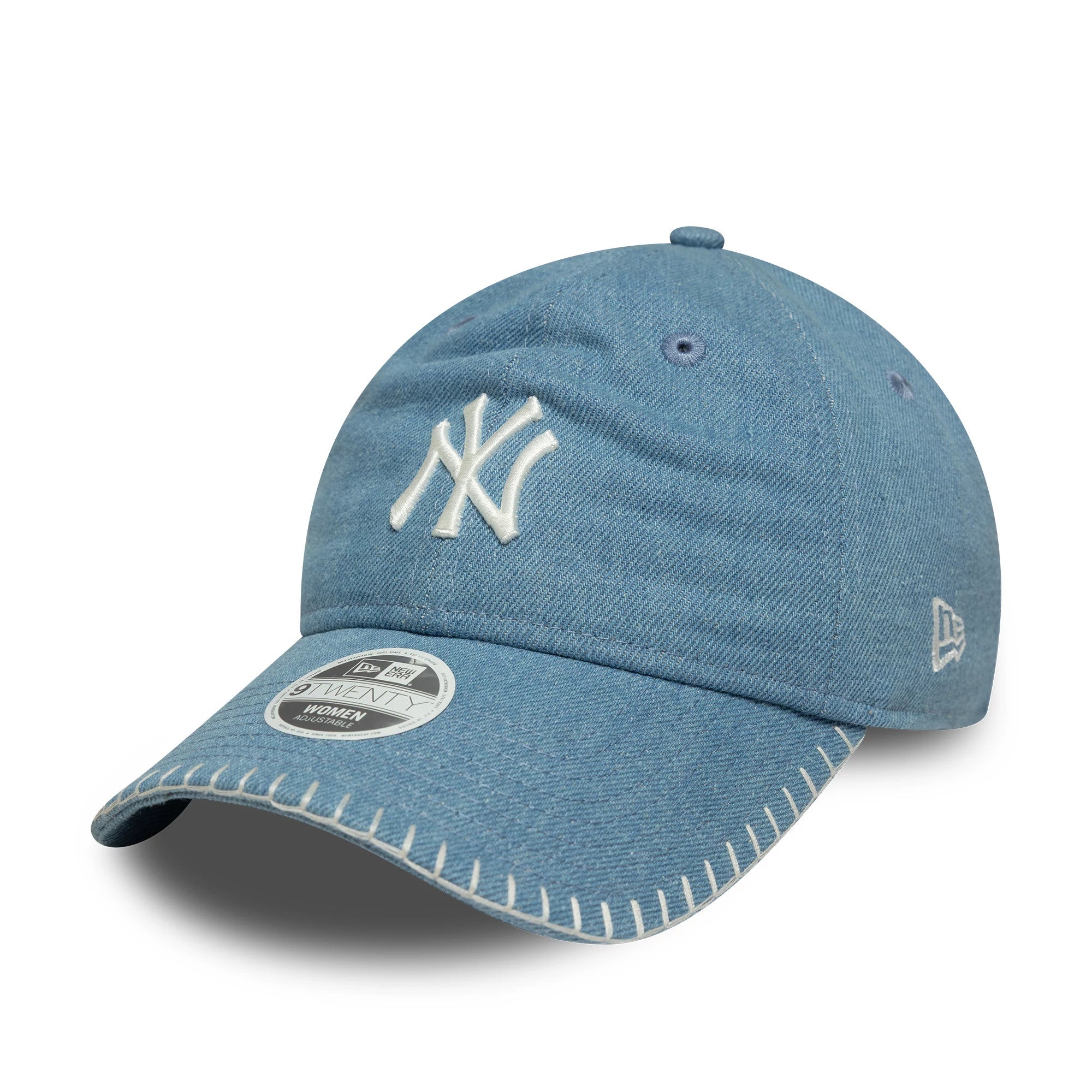 New York Yankees Womens MLB Denim Stitch Pastel Blue New Era 9TWENTY Cap, three-quarter view showing white NY logo in raised embroidery on the soft blue denim front panel, white stitching along the visor and a 9TWENTY size sticker.