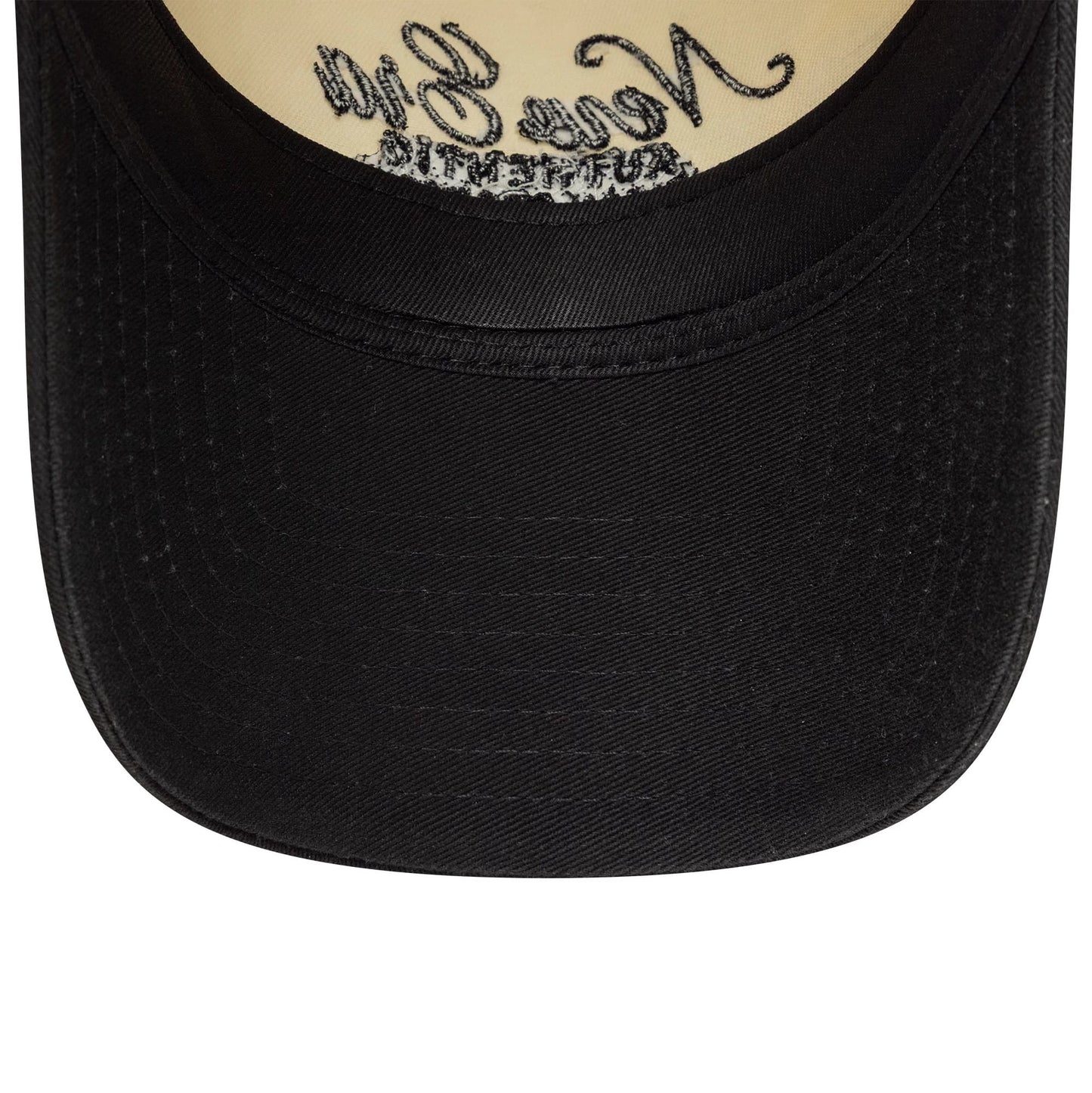 Womens New Era Black 9TWENTY A-Frame Cap, inside view showing a beige undervisor with black embroidery on the edge under the curved black visor, highlighting the contrast against the inner cap material.
