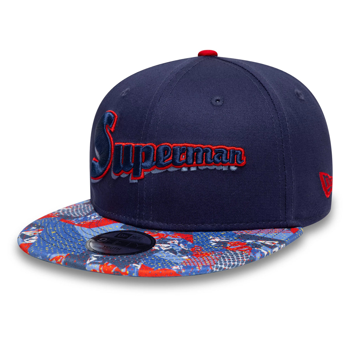 Youth DC Superman Navy New Era 9FIFTY Snapback Cap, front view with raised Superman script in blue edged with red on the navy crown, a colourful red and navy comic-pattern visor, and the 9FIFTY size sticker on display.
