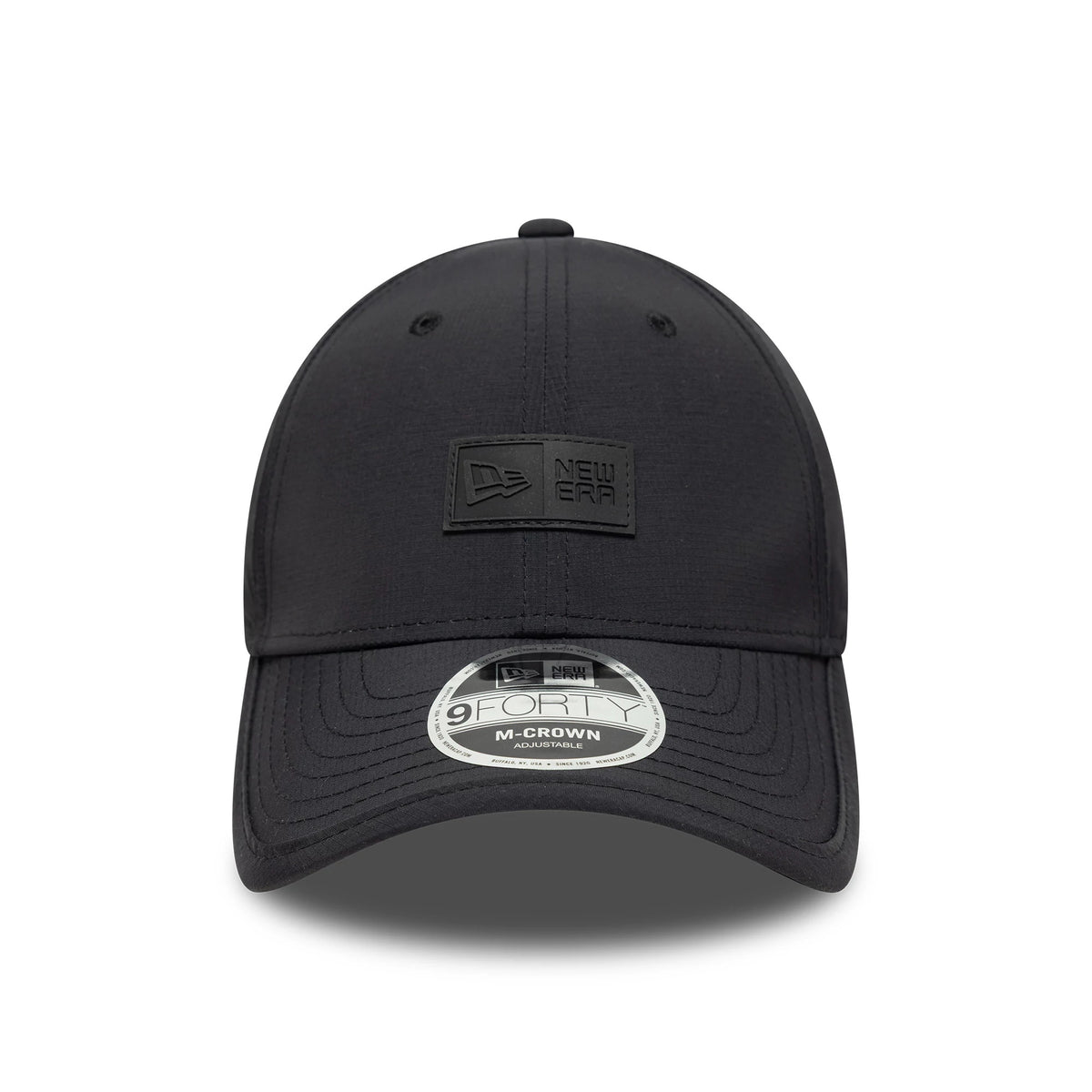 New Era Sport Black New Era 9FORTY M-Crown Cap, front view showing the raised black rectangular logo on the front panel above the curved black visor with a 9FORTY size sticker.