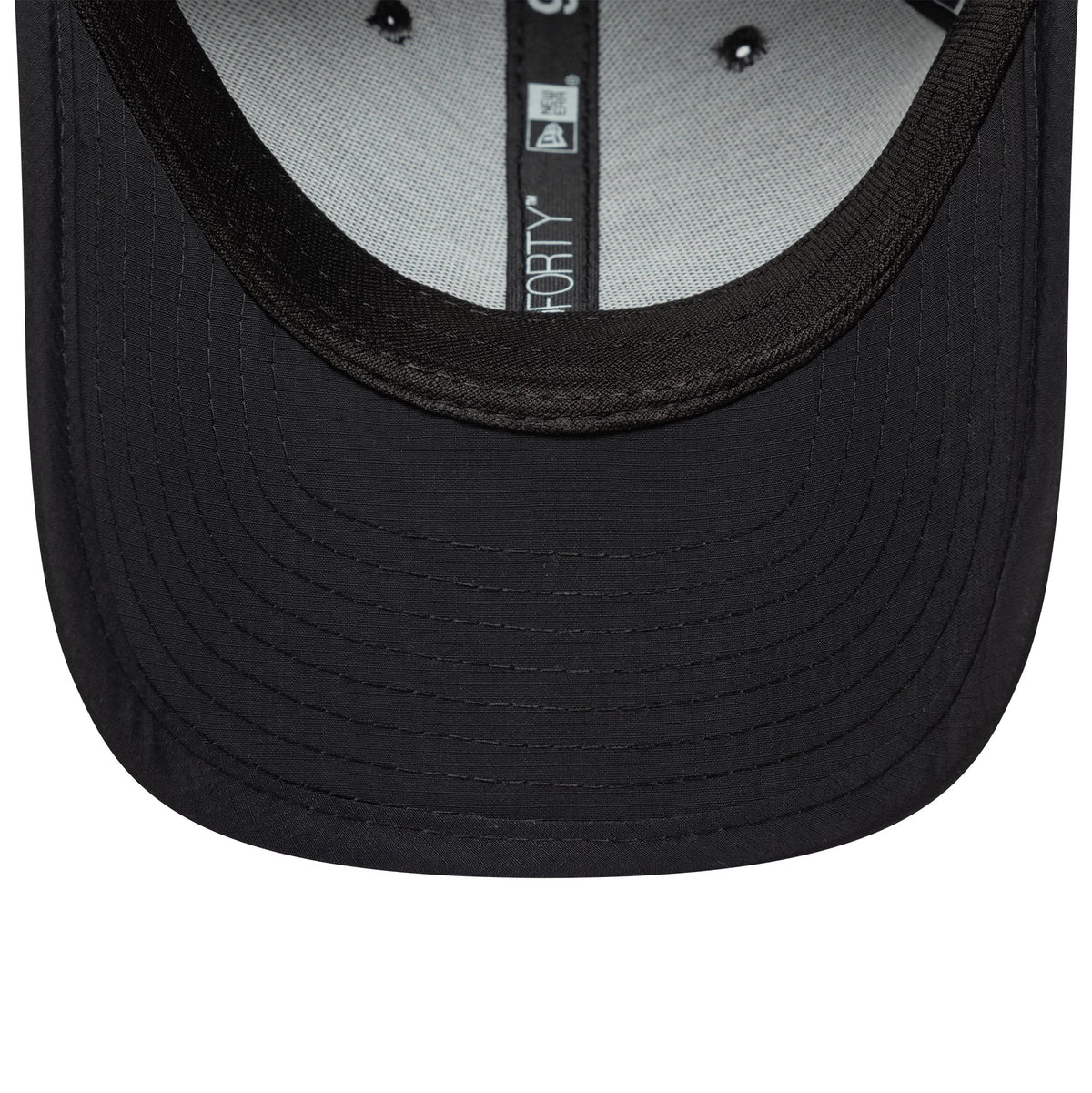 New Era Sport Black 9FORTY M-Crown Cap, inside view showing the black sweatband, grey undervisor, and the inner taping with the New Era and 9FORTY logos, plus the detailed stitching on the black visor.