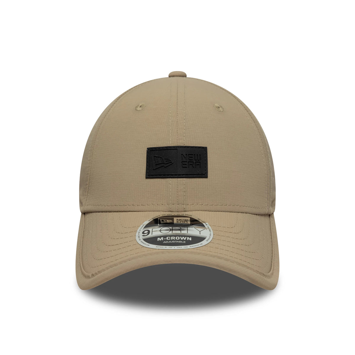 New Era Sport Light Beige 9FORTY M-Crown Cap, front view showing a black New Era patch on the centre front panel with a curved light beige visor and a 9FORTY size sticker centrally placed on the visor.