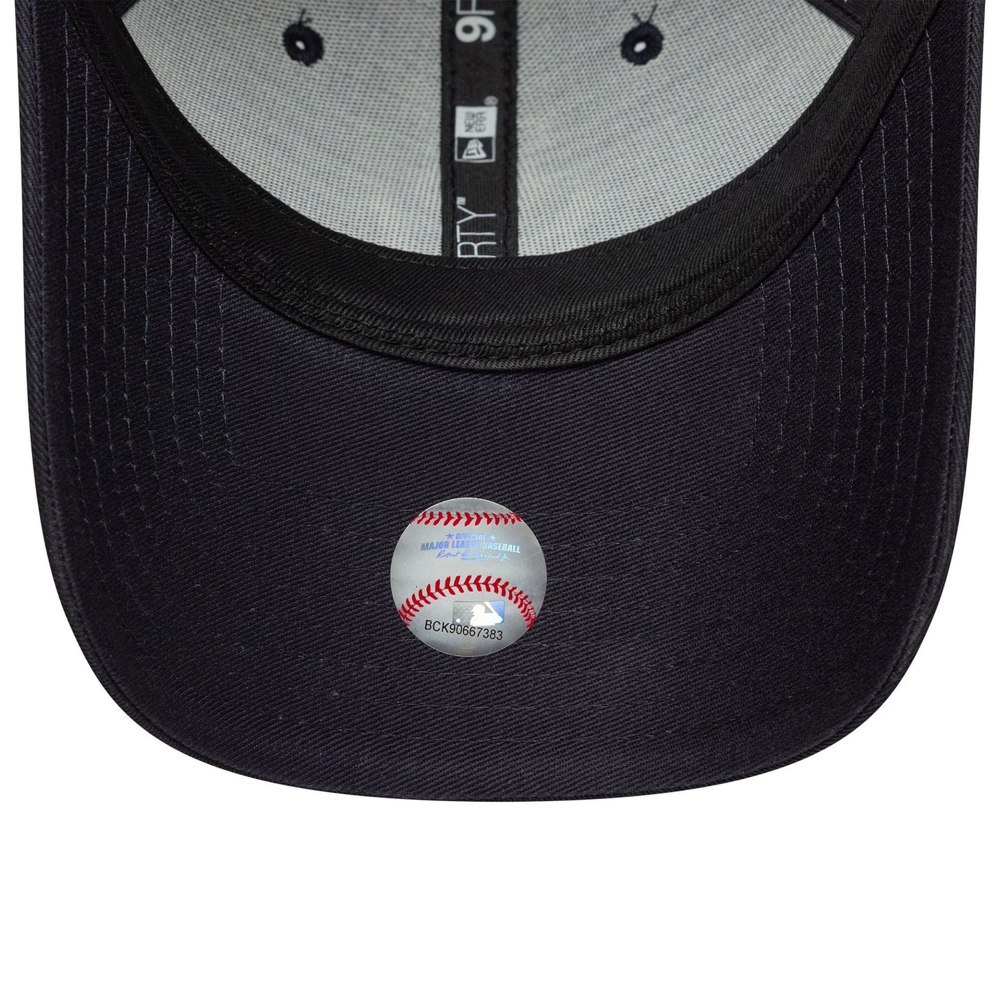 New York Yankees MLB Fruit Icon Navy New Era 9FORTY Cap, inside view showing black taping with New Era branding, grey sweatband, and an MLB holographic sticker on the navy undervisor.