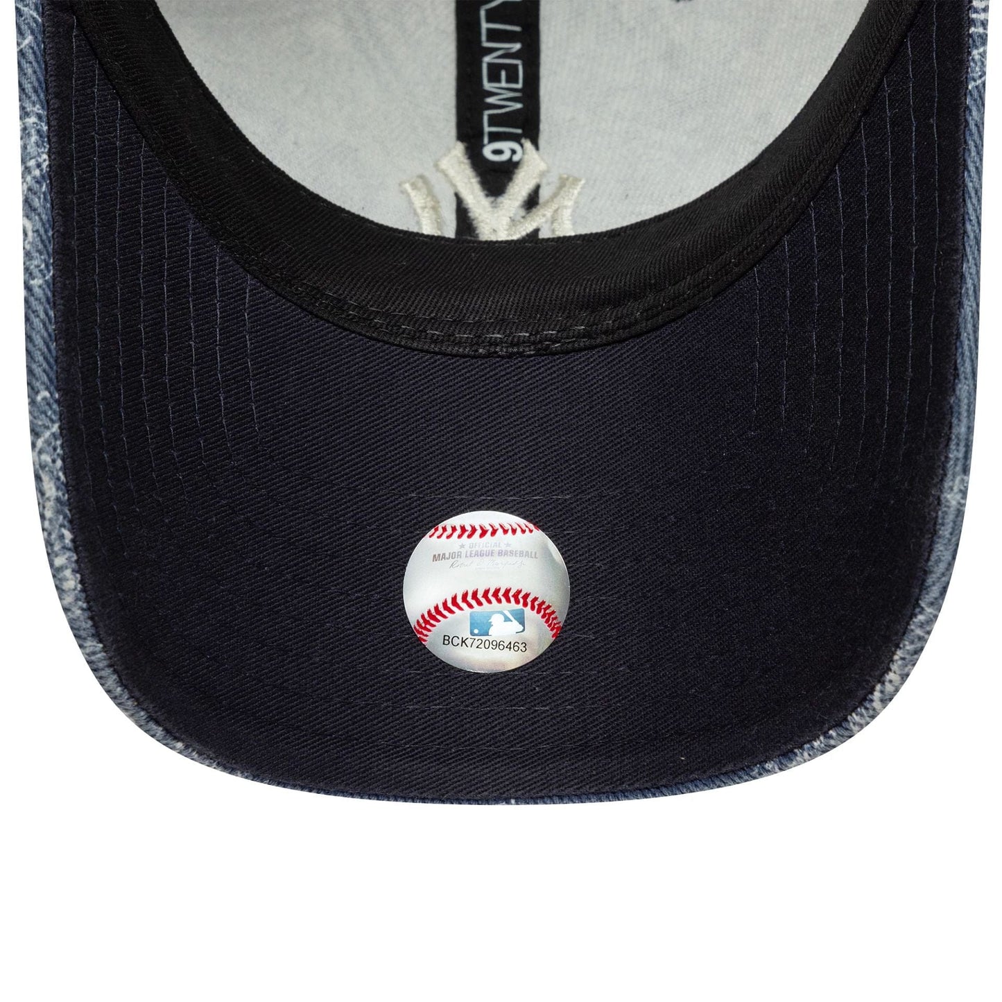 New York Yankees MLB Washed Paisley Navy New Era 9TWENTY Cap, inside view showing a black undervisor with an MLB authentication sticker, contrasting white inner taping, and the New Era 9TWENTY label along the centre panel.