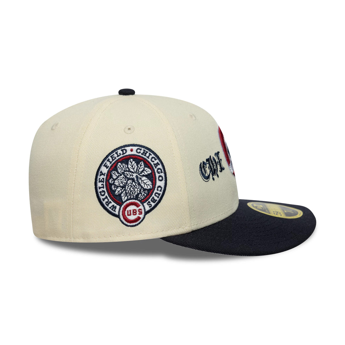 Chicago Cubs MLB Cooperstown Cream Low Profile New Era 59FIFTY Fitted Cap, side view showing a blue and red embroidered Wrigley Field patch on the cream crown, with a curved black visor and a gold 59FIFTY size sticker on the top.