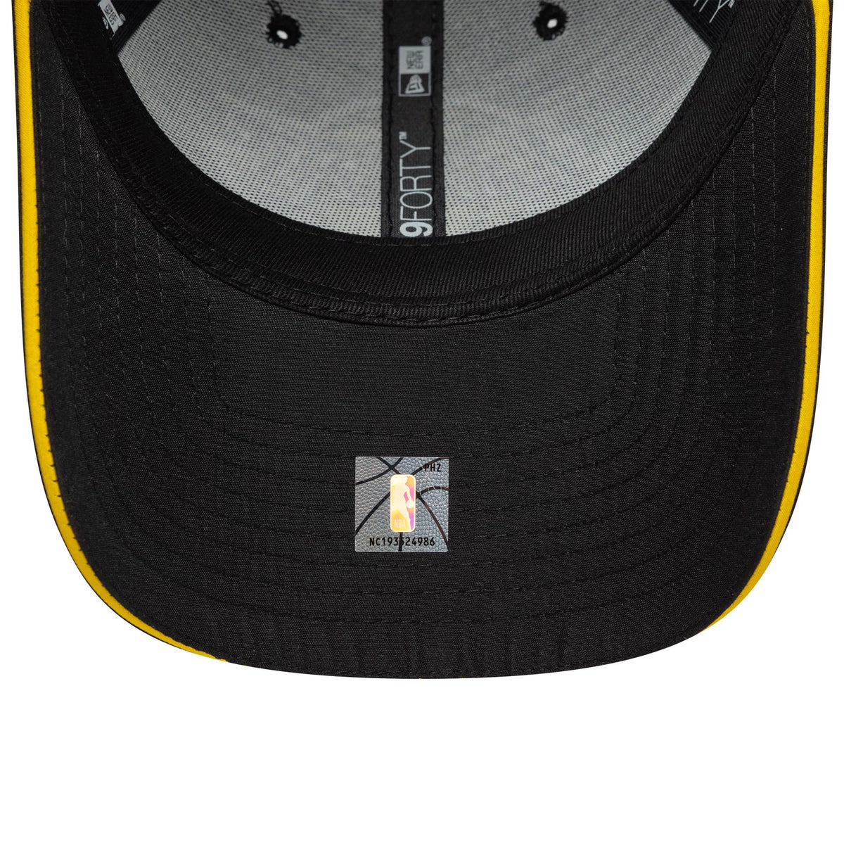 LA Lakers NBA Microfibre Black New Era 9FORTY Cap, inside view showing the grey taping with black New Era branding, a yellow-lined black undervisor, and a small NBA sticker centrally placed underneath the visor.