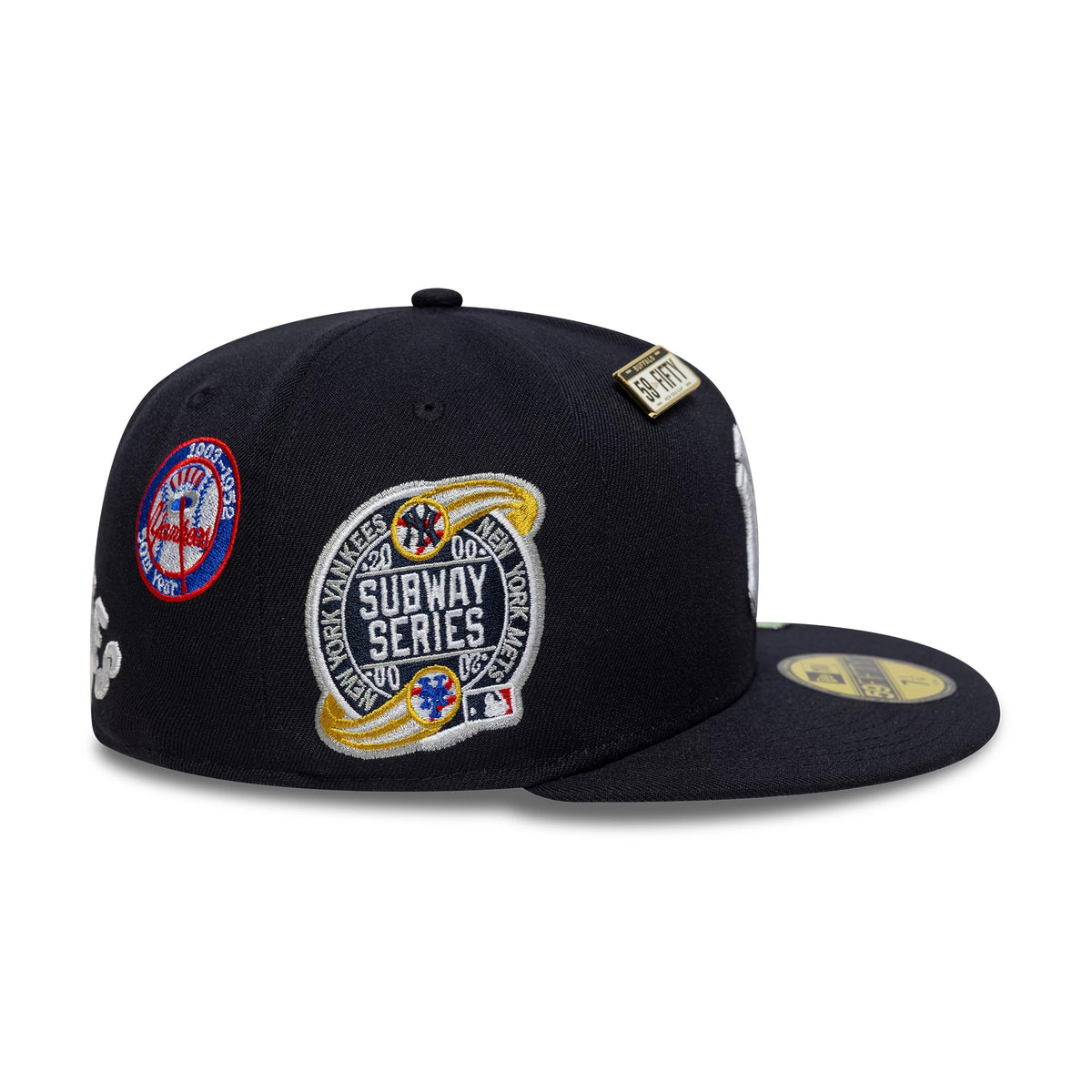 New York Yankees MLB Subway Series Navy New Era 59FIFTY Fitted Cap, side view showing the large embroidered Subway Series patch on the right panel, a commemorative logo near the back, and a gold 59FIFTY size sticker on the flat visor.