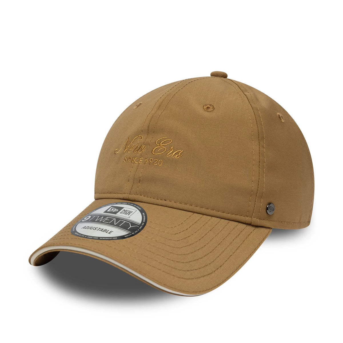 New Era Heritage Light Beige 9TWENTY Cap, three-quarter view showing the embroidered New Era script logo in matching beige on the front panel, a curved visor with stitching, and a 9TWENTY size sticker on the visor.
