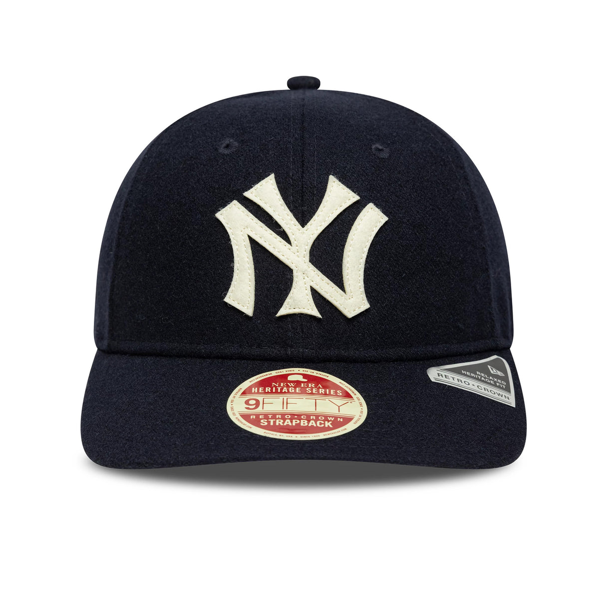 New York Yankees MLB Heritage Navy Retro Crown New Era 9FIFTY Cap, front view showing a large cream embroidered NY logo centred on the navy crown, with a round Heritage Series 9FIFTY size sticker on the curved visor.
