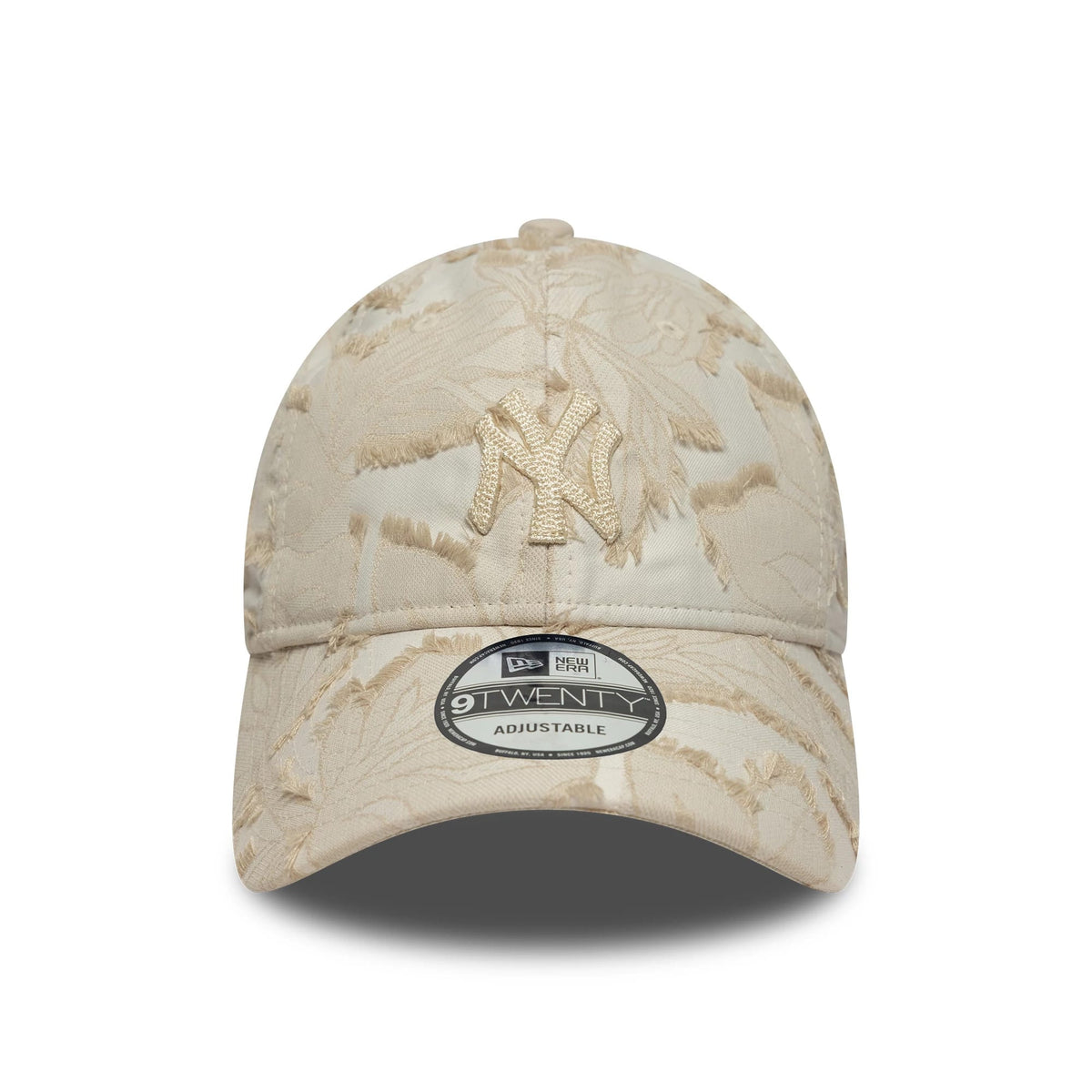 New York Yankees MLB Floral Cream New Era 9TWENTY Adjustable Cap, front view showing the beige embroidered Yankees logo on the floral-patterned cream fabric, with a 9TWENTY size sticker on the curved visor.