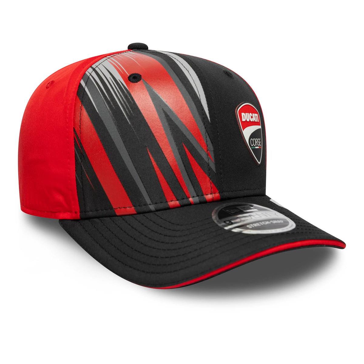 Ducati Motor Logo Print Black New Era 9SEVENTY Stretch Snap Cap, three-quarter view showing the raised Ducati badge on the front panel, dynamic red and grey streaks across the crown, and a 9SEVENTY size sticker on the black curved visor.