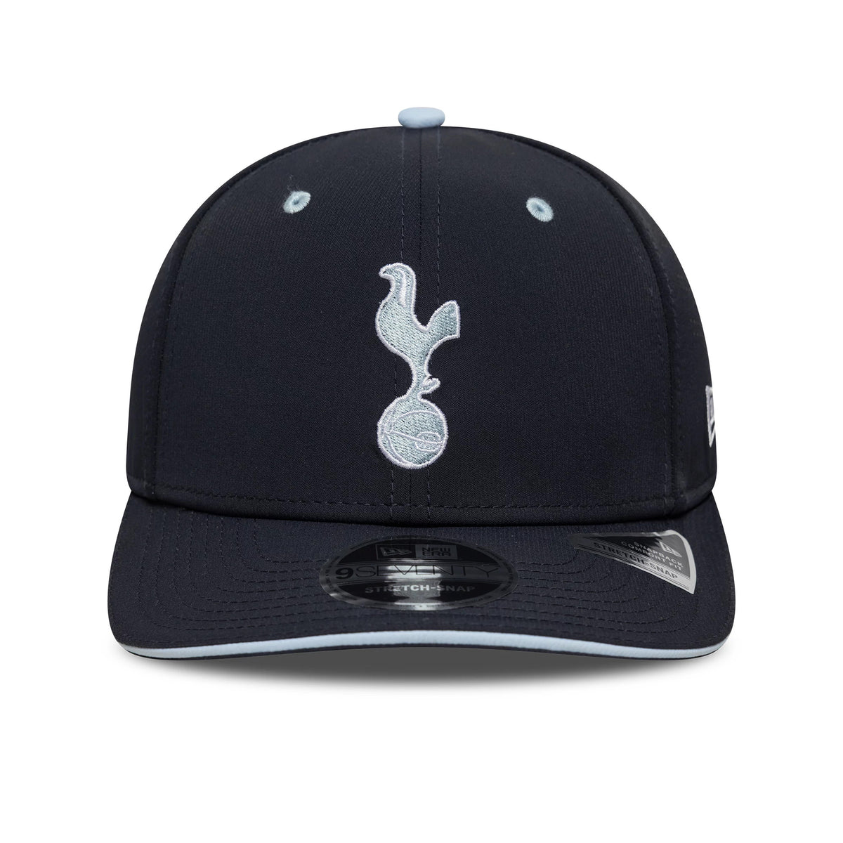 Tottenham Hotspur FC Cockerel Navy New Era 9SEVENTY Stretch Snap Cap, front view with a light blue embroidered cockerel logo on the navy crown, navy visor with light blue edging, and black 9SEVENTY size sticker on top.