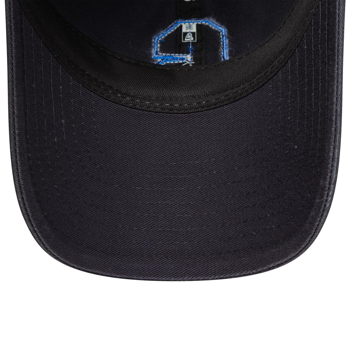 Chelsea FC Lion Crest Boucle Navy New Era 9TWENTY Cap, inside view showing the black sweatband and navy undervisor with stitched taping in blue and a size label near the crown.
