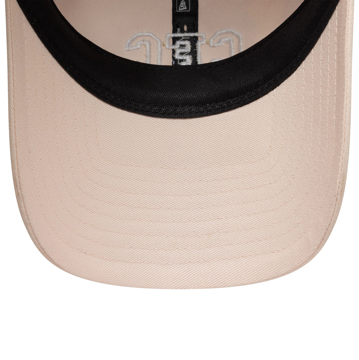 Chelsea FC Lion Crest Womens Pastel Pink New Era 9TWENTY Cap, inside view showing the black sweatband, pastel pink undervisor, black taping with the New Era logo, and embroidered design on the front panel.