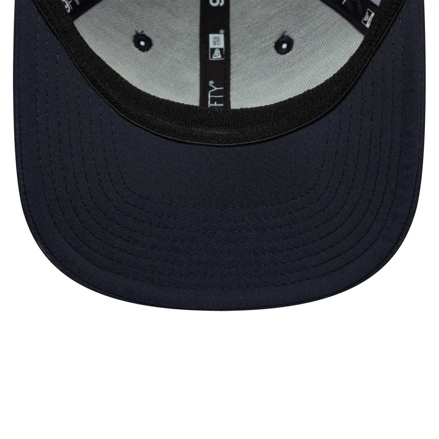 Pictured is this All Over Print Alpine Racing 9FIFTY Stretch Snap in navy. 5