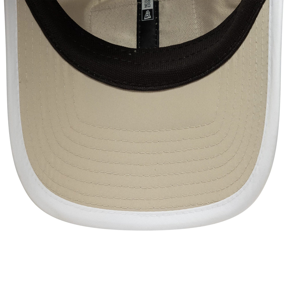 New Era Red Bull Racing Womens Light Beige Pony Tail Cap, inside view showing the black sweatband, beige undervisor with detailed stitching, and New Era branding on the internal taping.