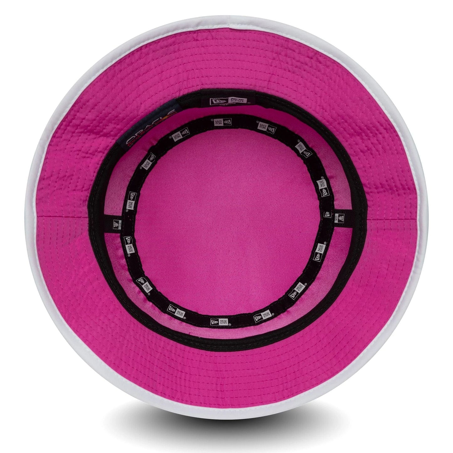 New Era Red Bull Racing Womens Bright Pink Bucket Hat, inside view showing the bright pink interior with a black sweatband and New Era branded taping, featuring white stitching around the visor.