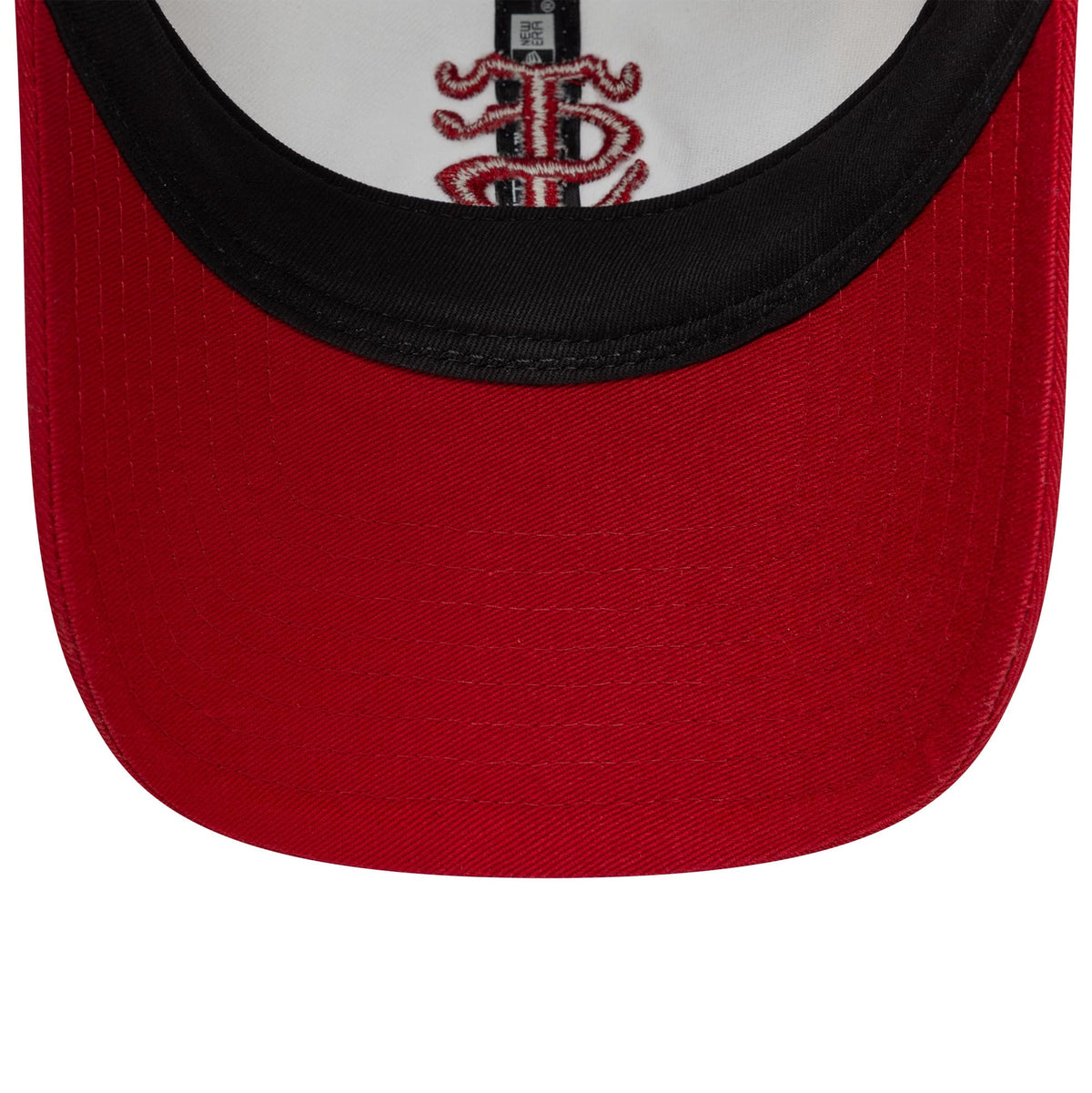 Stade Toulousain Contrast Visor White New Era 9TWENTY Cap, inside view showing the black sweatband encircling the red undervisor with a detailed black and red Stade Toulousain logo embroidered on the white fabric.