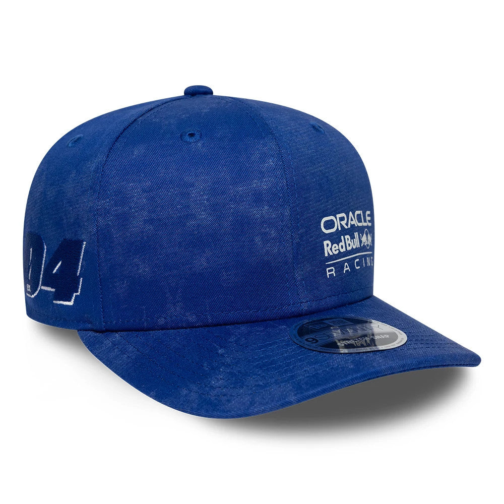 Red Bull Racing Washed Denim Blue New Era 9SEVENTY Stretch Snap Cap, three-quarter view showing the white Oracle Red Bull Racing logo in raised embroidery on the front panel, with a flat blue visor and a 9SEVENTY size sticker.