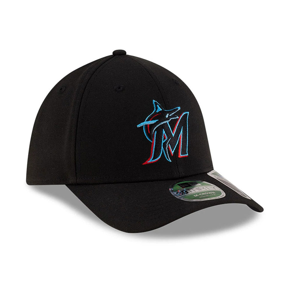 Marlins MLB Player Replica Black New Era 39THIRTY M-Crown Stretch Fit Cap, three-quarter view showing the blue and red embroidered Marlins logo on the front panel and a green 39THIRTY size sticker on the curved black visor.