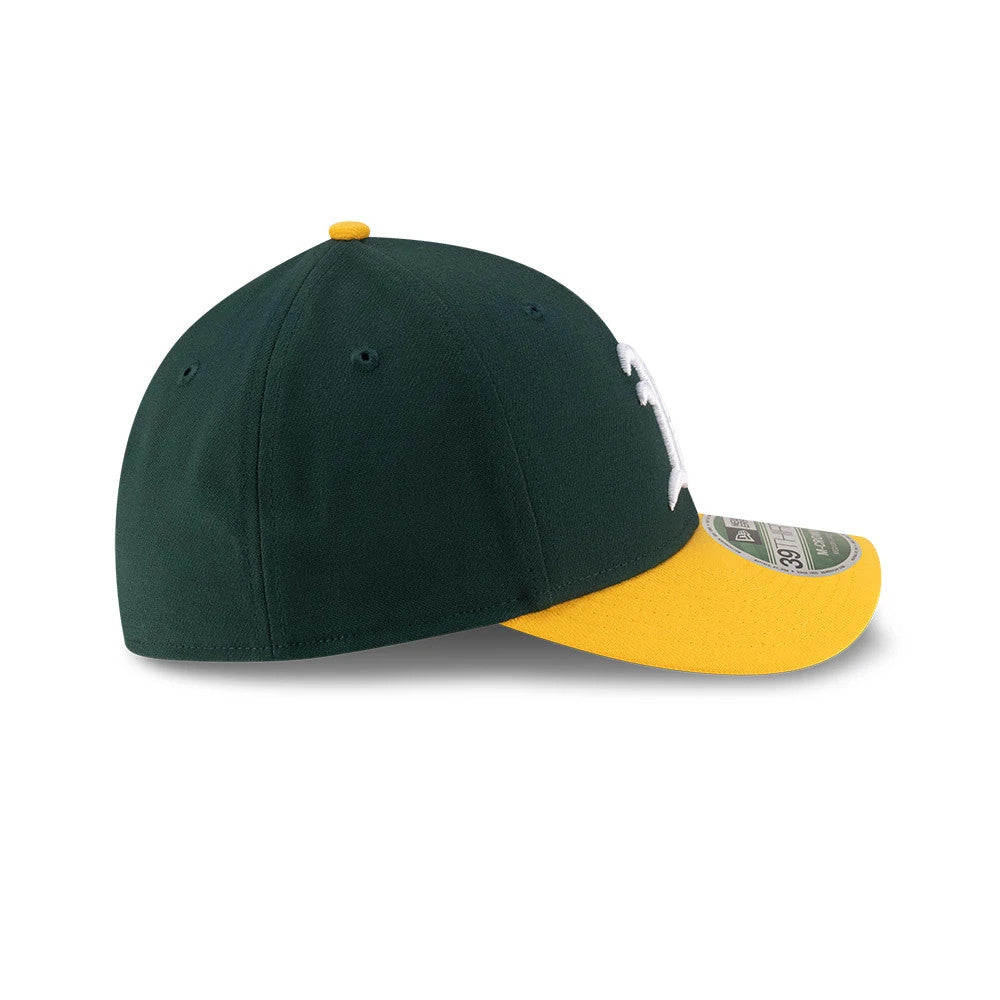 Athletics MLB Player Replica Dark Green New Era 39THIRTY M-Crown Stretch Fit Cap, side view with a curved yellow visor, embroidered white logo on the front panel, and green 39THIRTY size sticker on the visor.