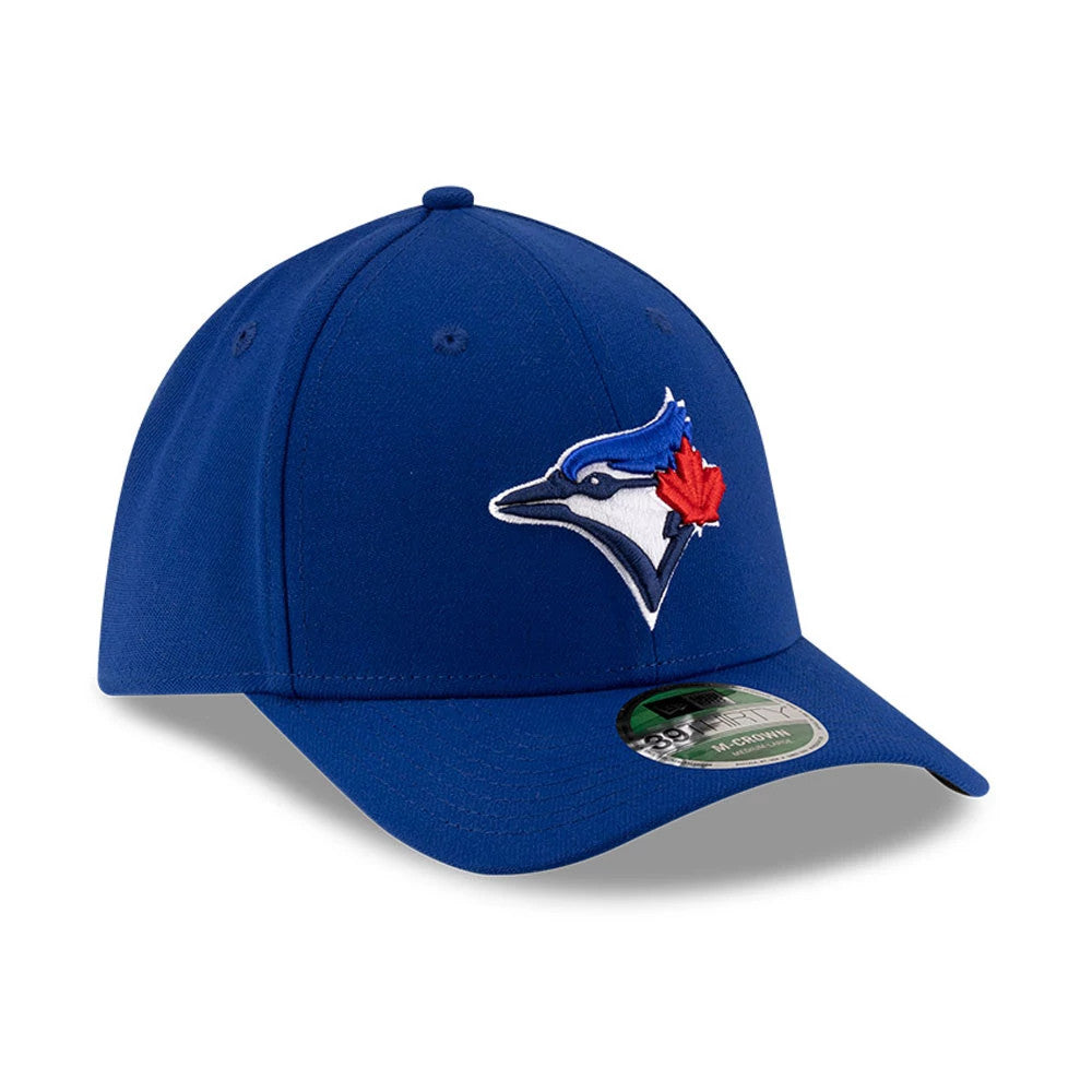 Blue Jays MLB Player Replica Blue New Era 39THIRTY M-Crown Stretch Fit Cap, three-quarter view showing the raised embroidered blue and red Blue Jays logo on the front panel, with a curved blue visor and 39THIRTY size sticker.