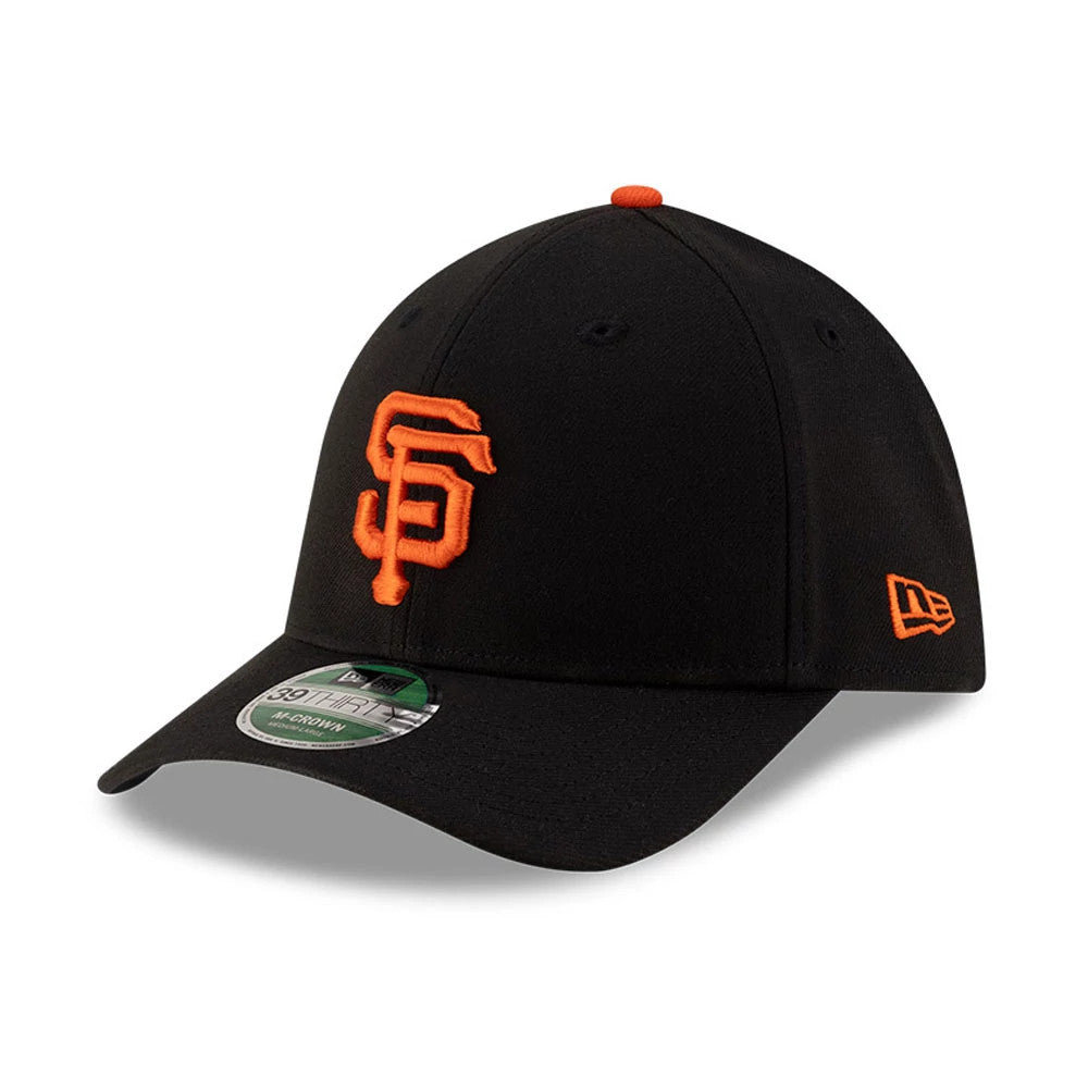 Giants MLB Player Replica Black New Era 39THIRTY M-Crown Stretch Fit Cap, front view showing the raised orange SF logo on the front panel, black curved visor with a 39THIRTY size sticker, and orange New Era flag logo on the left side.