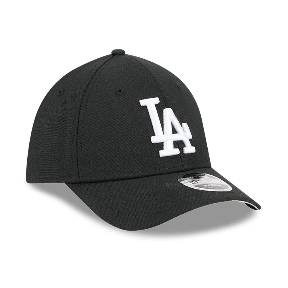 LA Dodgers MLB Black New Era 39THIRTY M-Crown Stretch Fit Cap, three-quarter view showing the white embroidered LA logo on the front panel, black curved visor with a 39THIRTY size sticker, and black eyelets on the structured crown.