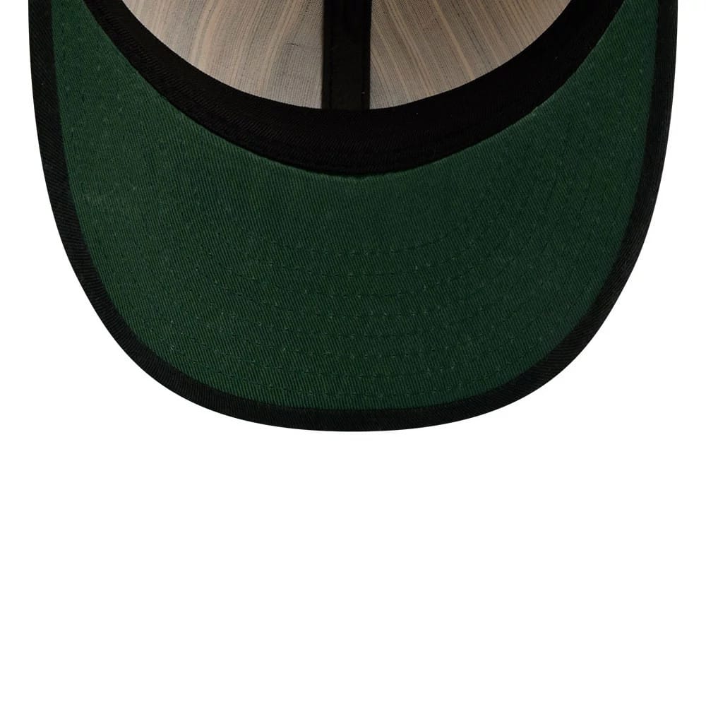 Arizona Diamondbacks MLB Americana Herringbone White Retro Crown New Era 9FIFTY Adjustable Cap, inside view featuring a green undervisor with a contrasting black edge and internal black band against a light wood-textured background.