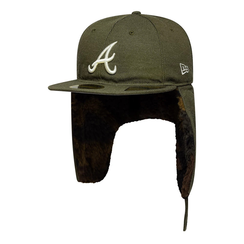 Atlanta Braves MLB Camo Open Green Retro Crown Dogear New Era 59FIFTY Fitted Cap, three-quarter view showing the white embroidered A logo on the front panel, green flat visor with a gold 59FIFTY size sticker, and brown faux fur ear flaps.