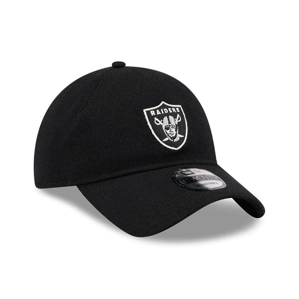 Las Vegas Raiders NFL Merino Wool Black New Era 9TWENTY Adjustable Cap, three-quarter view showing the white embroidered Raiders shield logo on the front panel, with a curved black visor and 9TWENTY size sticker.