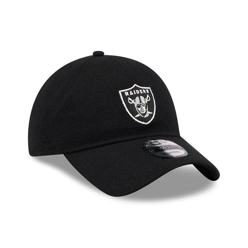 Las Vegas Raiders NFL Merino Wool Black New Era 9TWENTY Adjustable Cap, three-quarter view showing the white embroidered Raiders shield logo on the front panel, with a curved black visor and 9TWENTY size sticker.