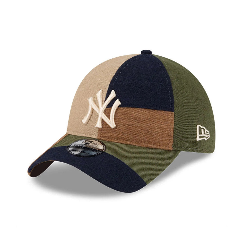New York Yankees MLB Patchwork Open Brown New Era 9TWENTY Adjustable Cap, three-quarter view showing the raised white NY logo on a multi-coloured patchwork crown with a curved visor, and the New Era flag logo embroidered in white on the left side.