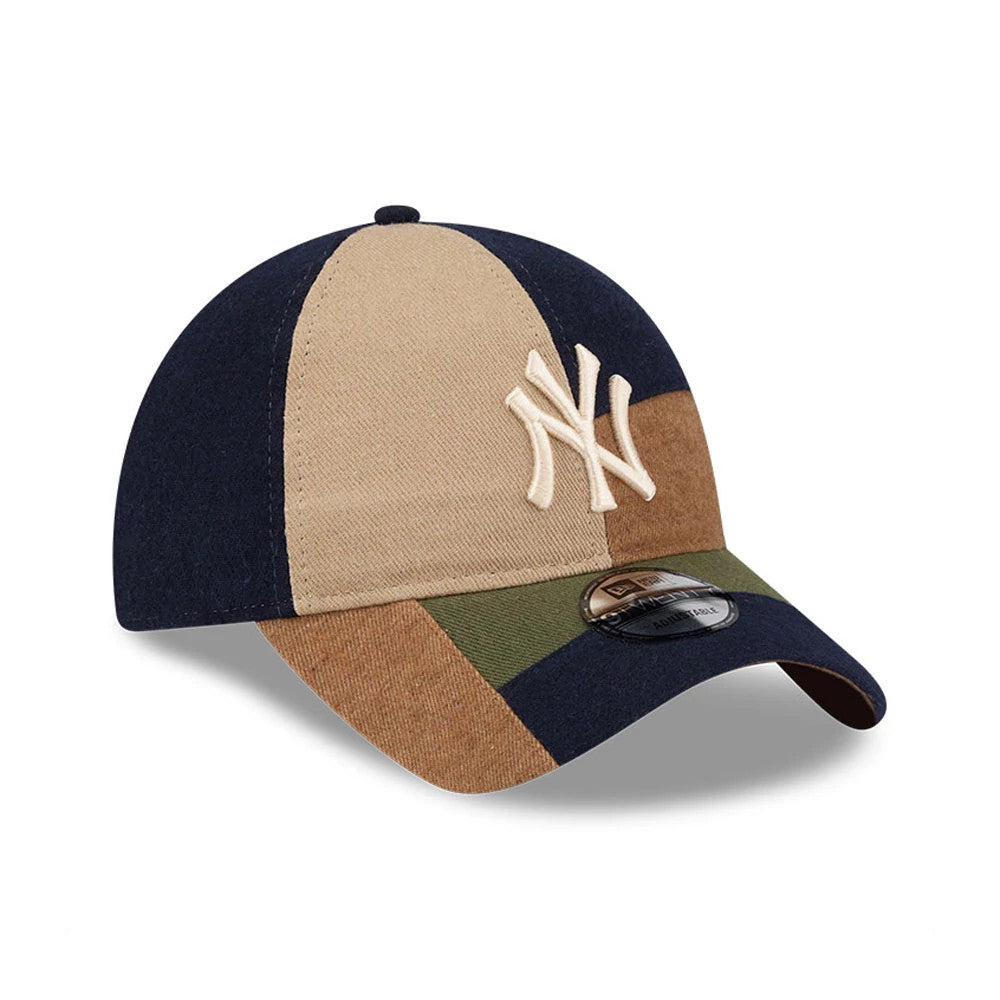 New York Yankees MLB Patchwork Open Brown New Era 9TWENTY Adjustable Cap, three-quarter view showing the cream embroidered NY logo on a panelled crown in contrasting navy, tan, brown, and green, with a black 9TWENTY size sticker on the visor.