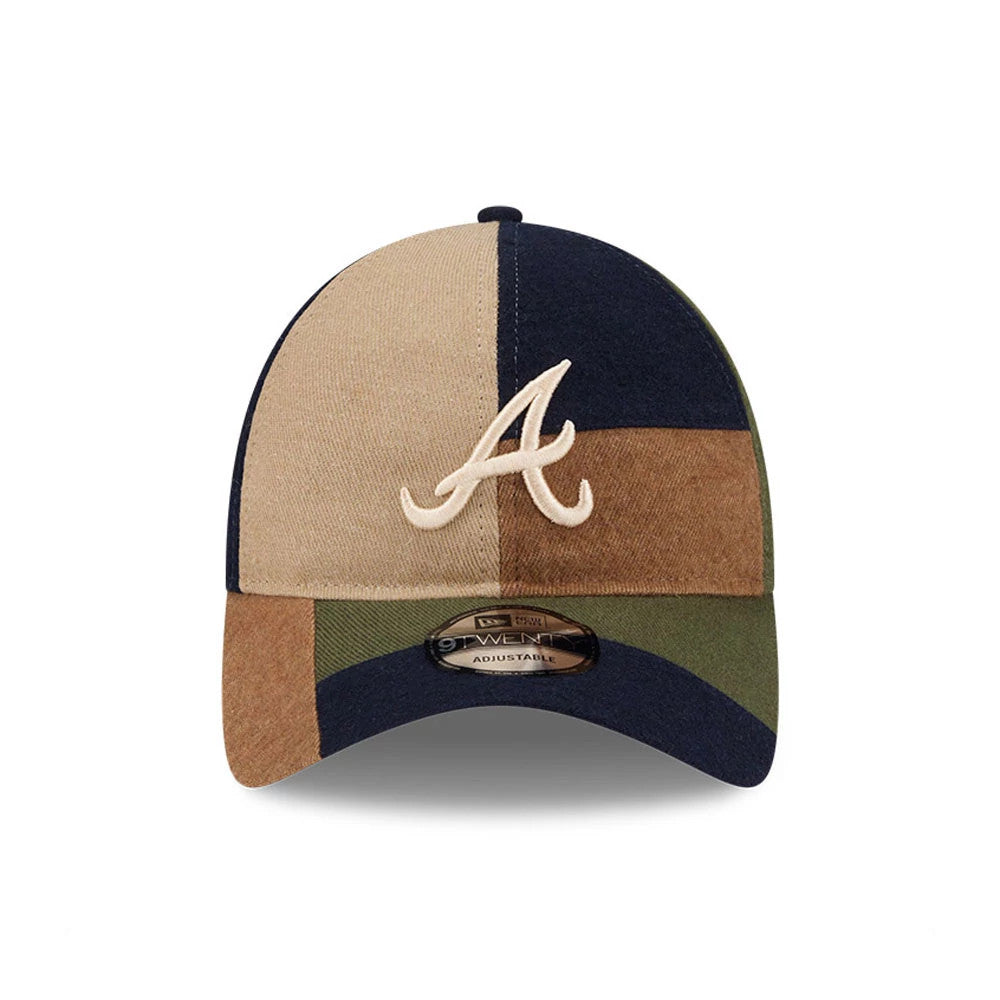 Atlanta Braves MLB Patchwork Open Brown New Era 9TWENTY Adjustable Cap, front view showing the cream A logo in raised embroidery on the patchwork crown with hues of brown, navy, and green, and a 9TWENTY size sticker on the curved visor.