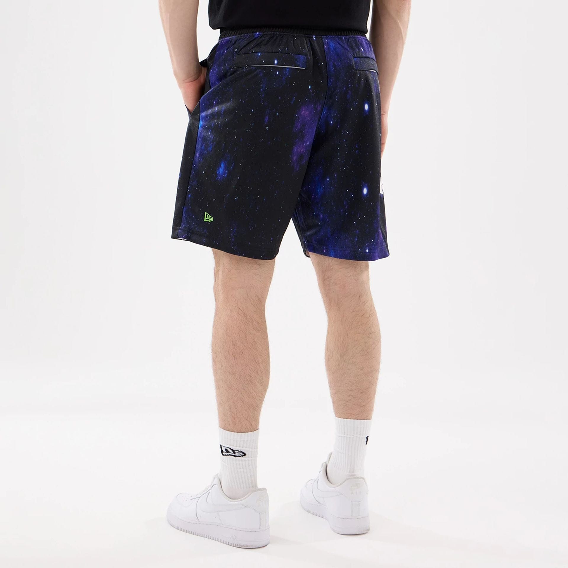 The model is wearing this Warner Brothers Space Jam Oversized Shorts in white. 2