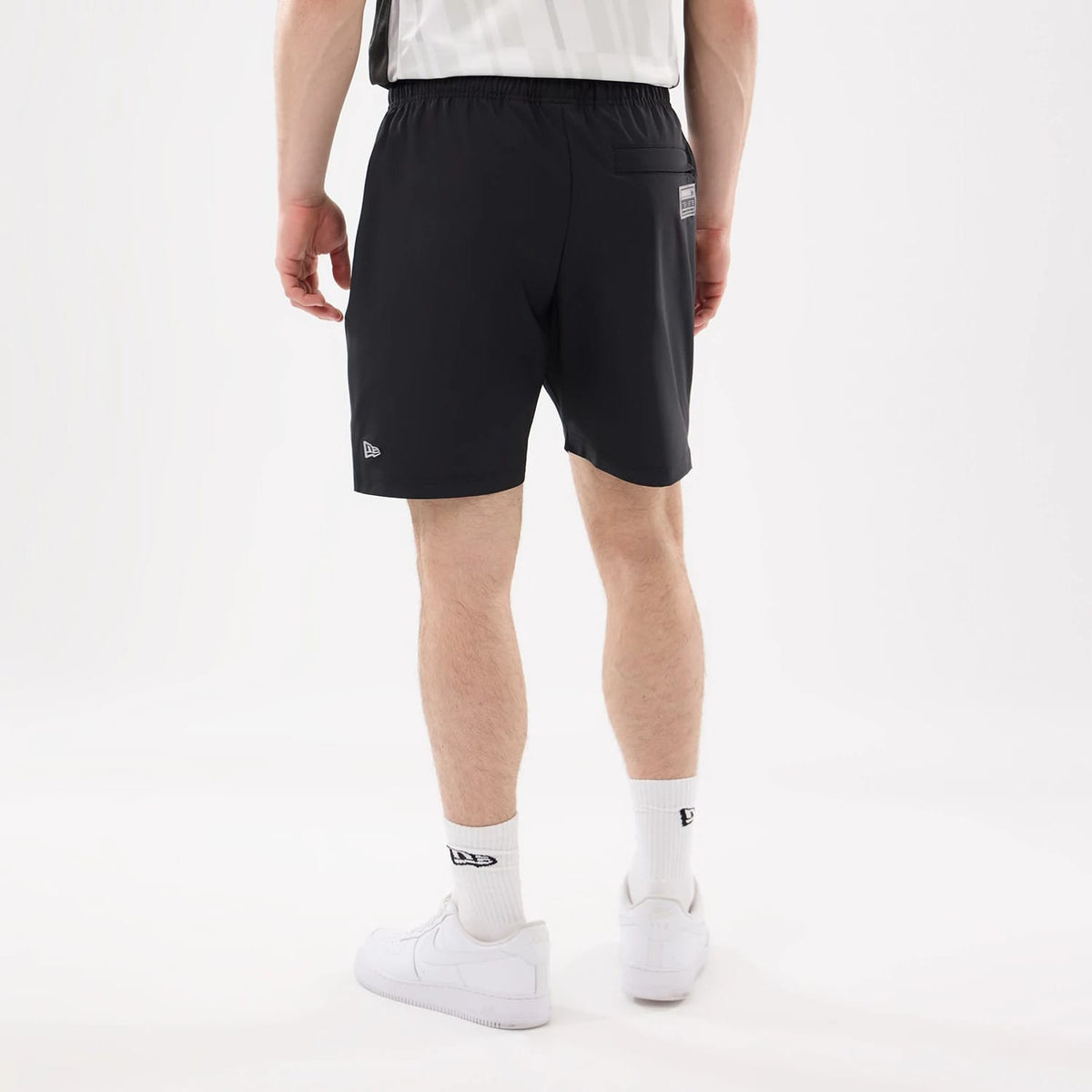 The model is wearing this NHL Match LA Kings Oversized Shorts in black. 2